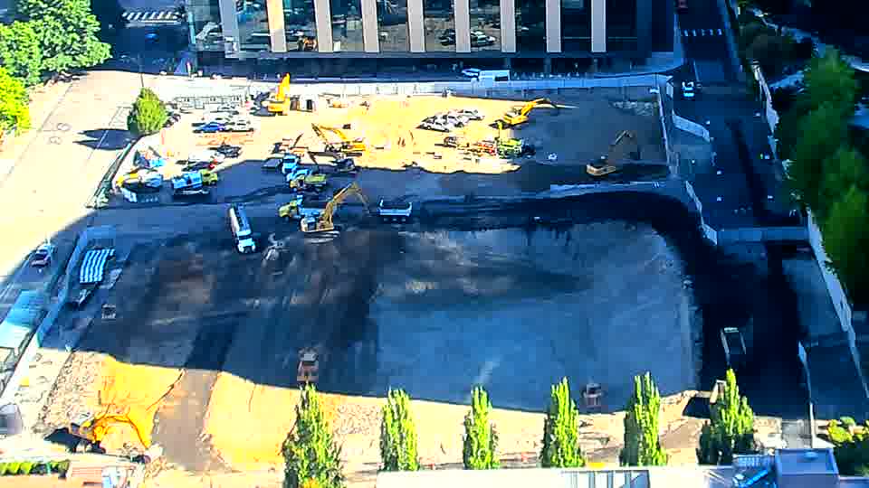 The machines on site appear to be in roughly the same positions as before, though there’s a subtle shift in the arrangement of materials closer to the center.