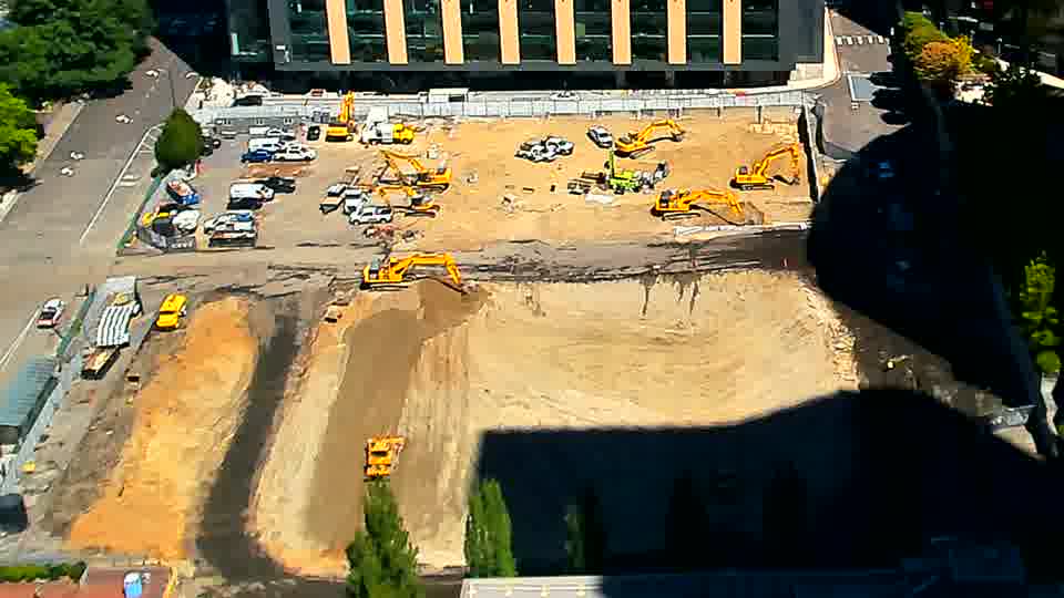 The site’s layout remains nearly identical, with only slight adjustments to the shadows falling across the graded area.