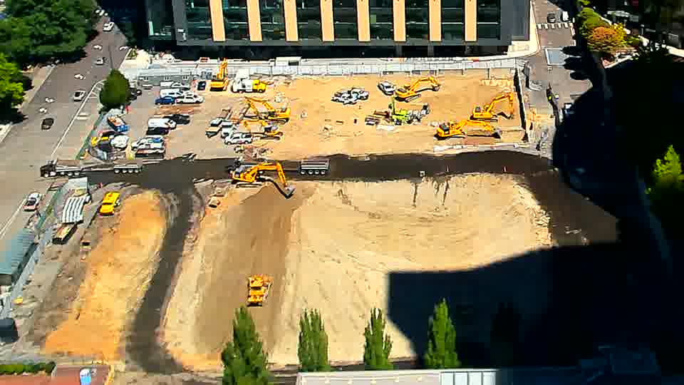 The arrangement of the heavy equipment appears stable, though shadows have subtly lengthened across the site in the last fifteen minutes.