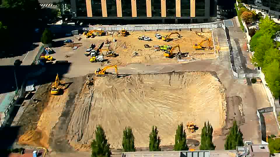 The view across the site is remarkably stable, with the positions of the machines and materials holding steady.