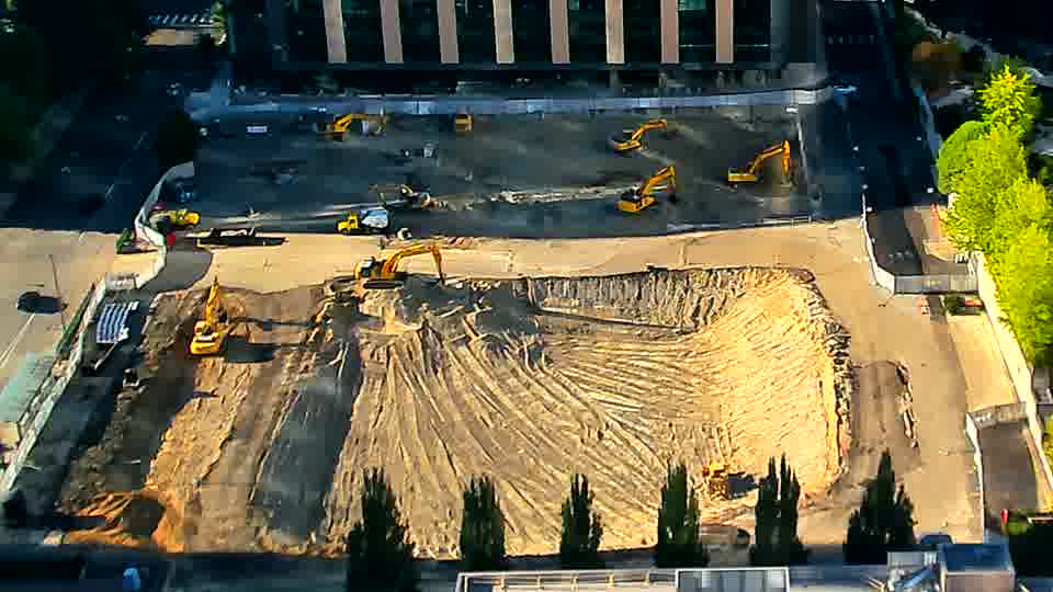 The pattern of tracks across the graded area appears a bit more defined, but overall the site remains in a similar state.