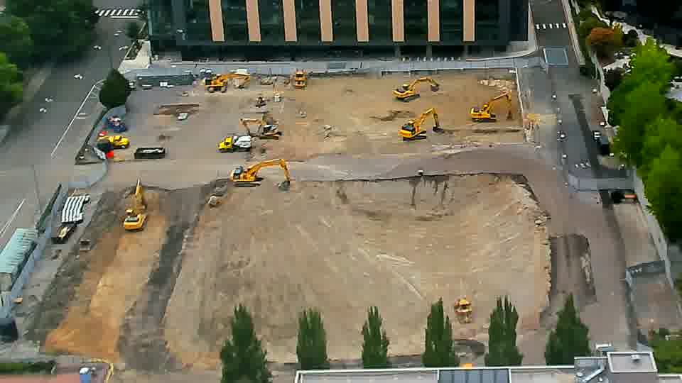 The overall layout of the site remains consistent, with the machinery holding its previous positions.