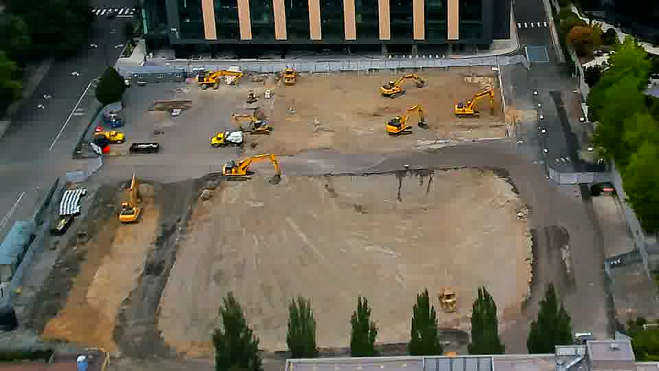 The scene remains largely as it was, with equipment holding its positions across the graded area.