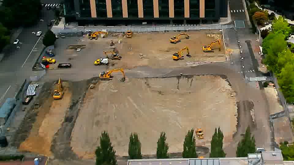 The view across the site remains remarkably still, with the positions of the excavators and dozers appearing unchanged.