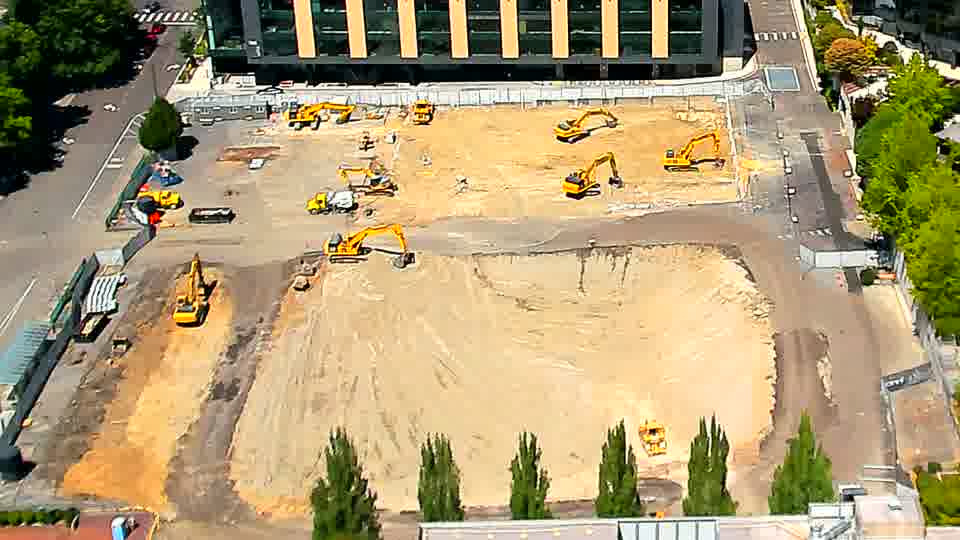 The equipment across the site maintains its positions, with no apparent alterations in the last quarter of an hour.