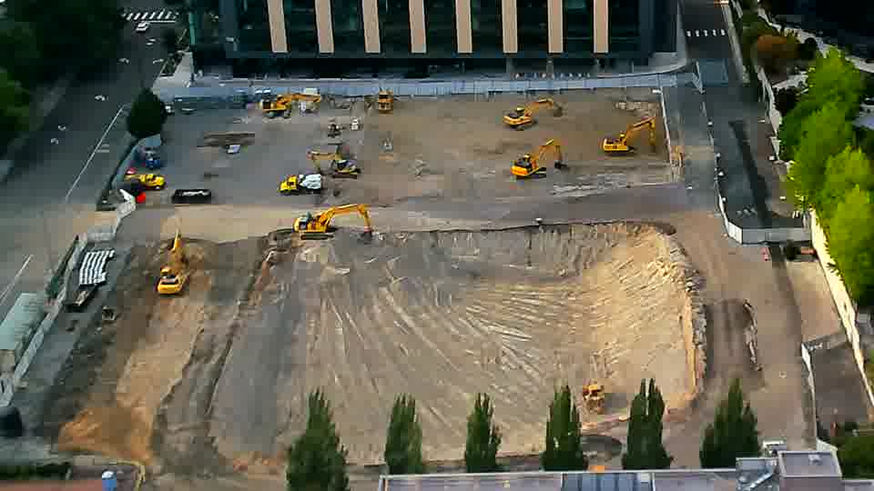 The site's machinery and materials show no noticeable repositioning in the intervening time.