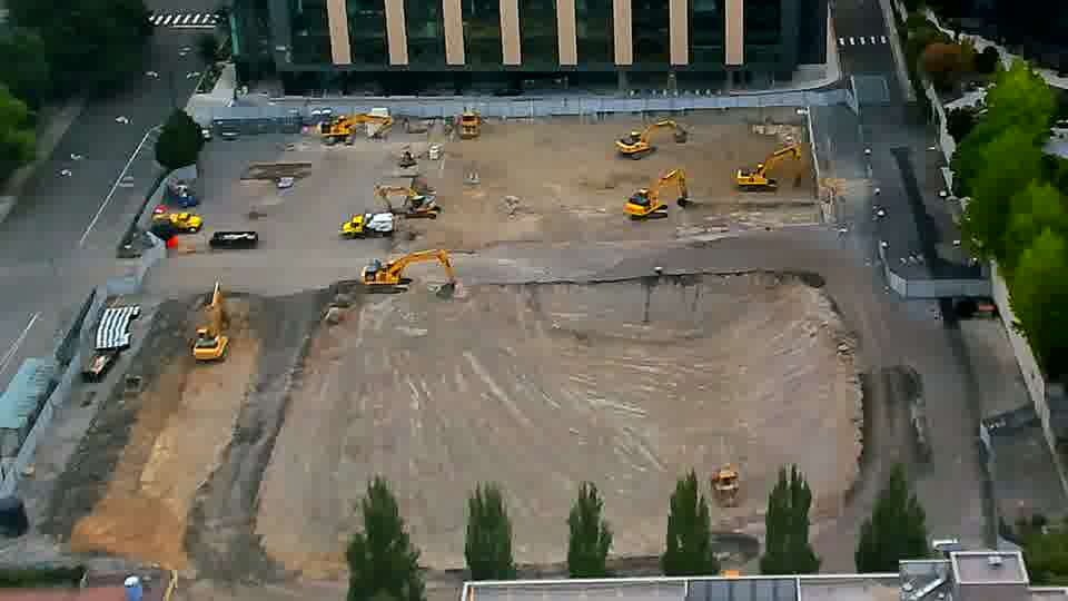 The scene presents a static view, as the positions of all visible machines and materials remain consistent.