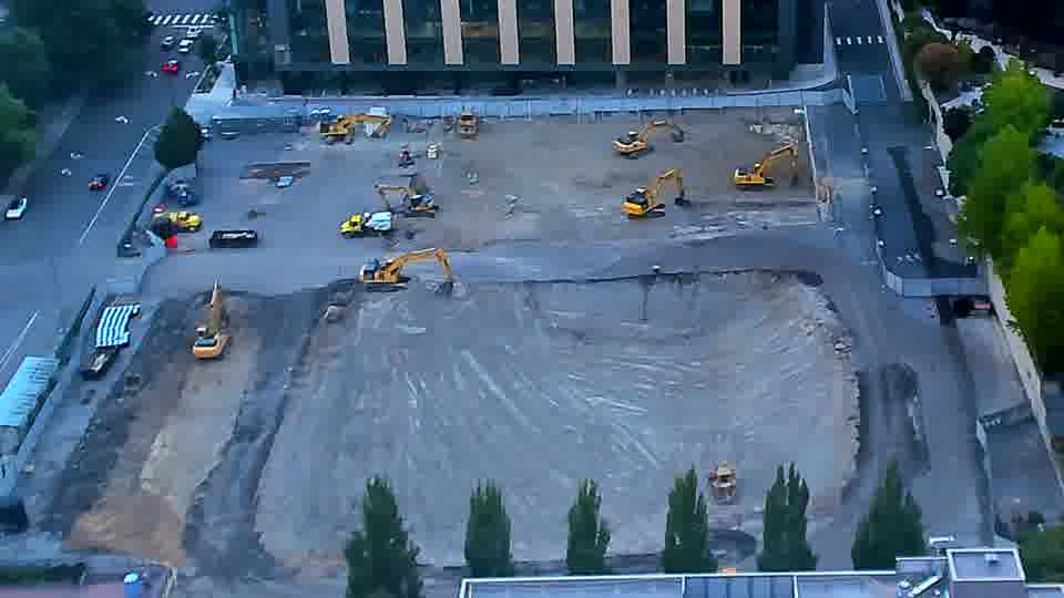 The site maintains a consistent appearance, with the positions of the tracked machinery largely unchanged.