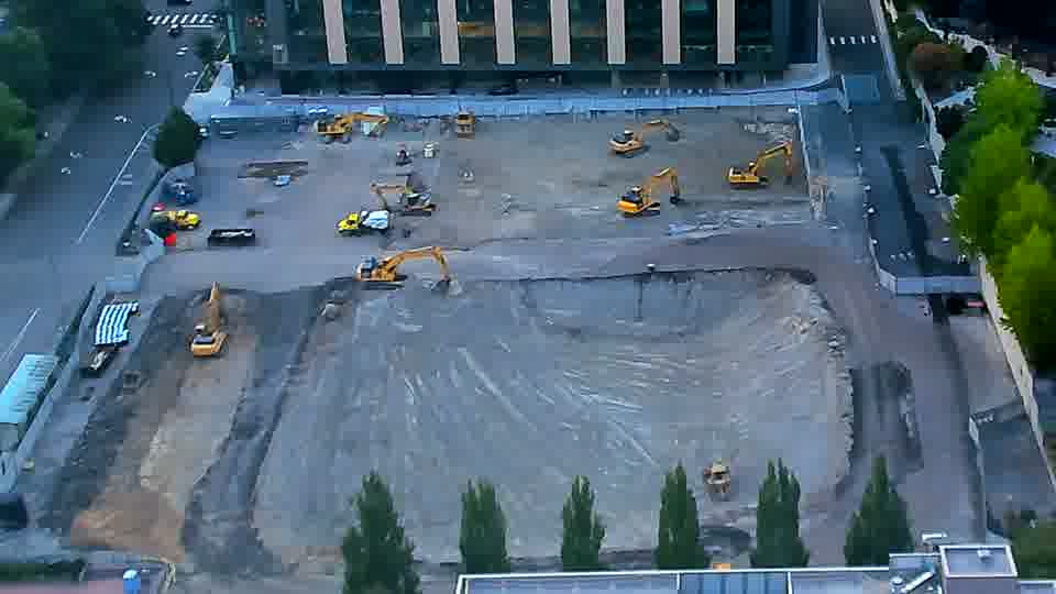 The scene remains largely as it was, with no apparent movement of equipment or materials over the last fifteen minutes.