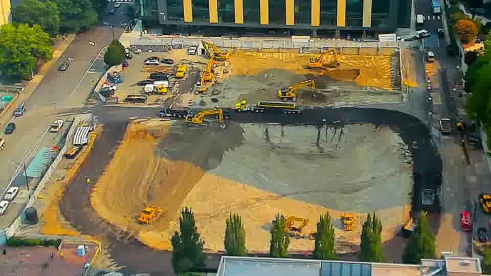 The site continues to show a steady state, with no discernible shifts in the placement of machines or stockpiled materials.