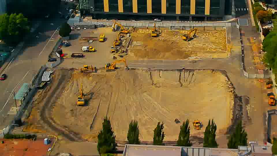 Equipment positions appear largely consistent, though some subtle shifts in the arrangement of machinery are visible in the central area.
