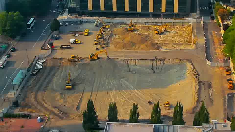The site appears largely unchanged, with the positions of the machines and materials remaining consistent in this view.