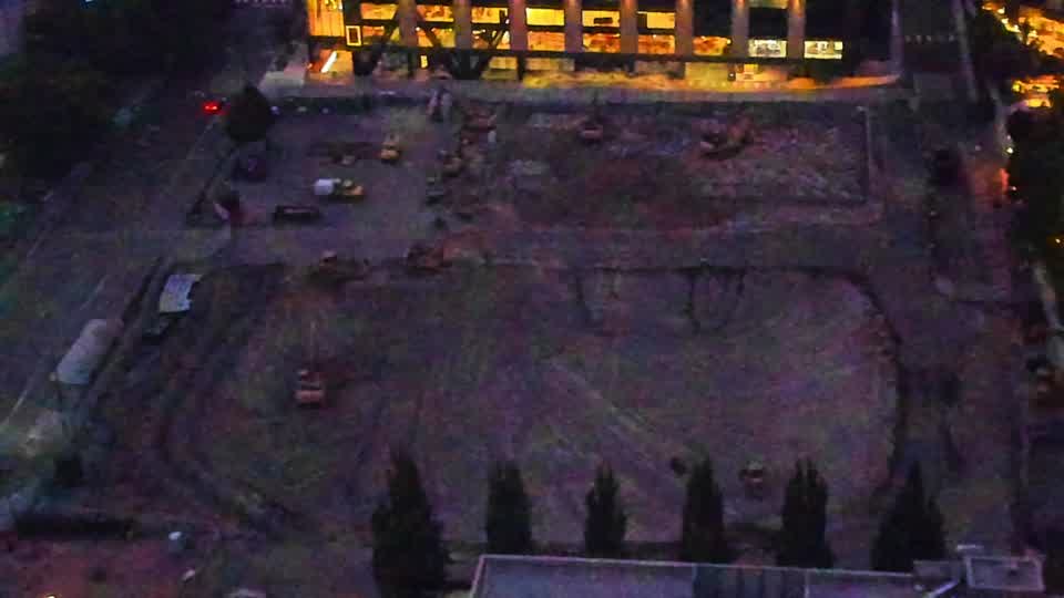 The site appears largely unchanged, with equipment and materials maintaining their previous locations.