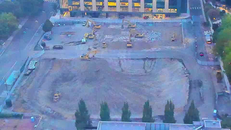 The site is largely unchanged, with equipment remaining in the same positions as fifteen minutes ago.
