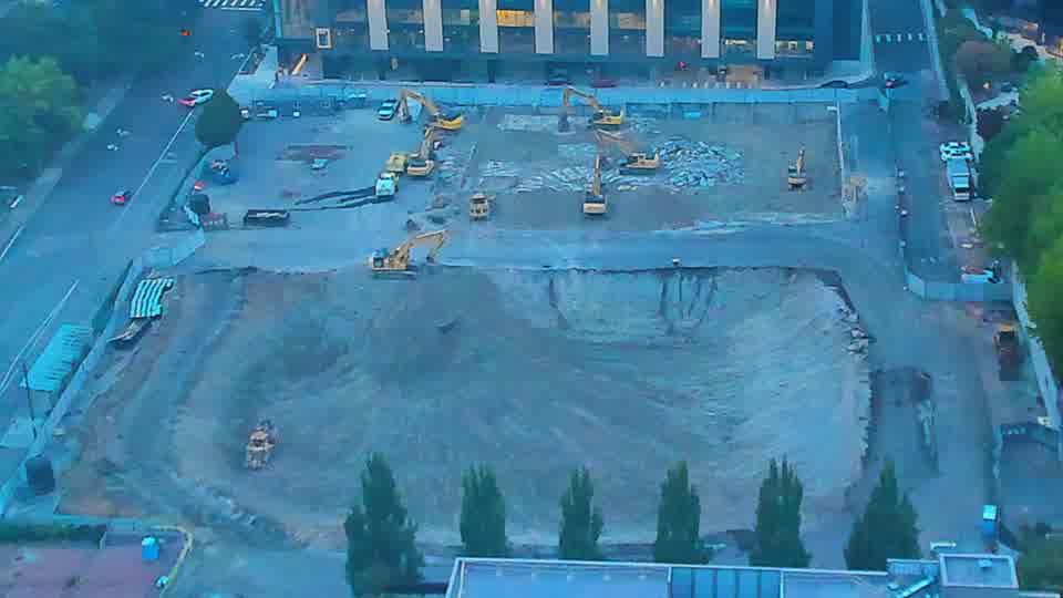 The scene is holding steady, with the arrangement of machinery appearing consistent between the two views.
