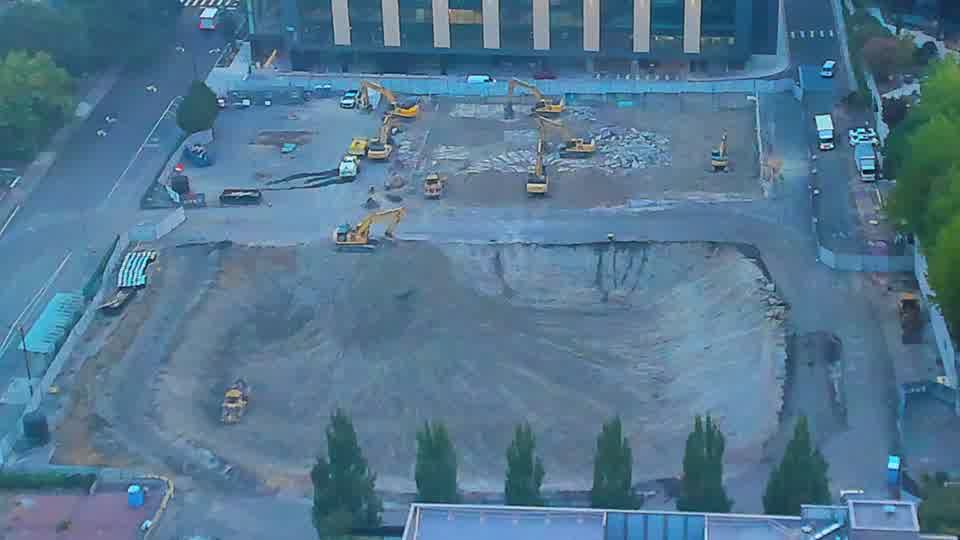 The arrangement of equipment across the site appears stable, with no noticeable shifts in position over the last fifteen minutes.