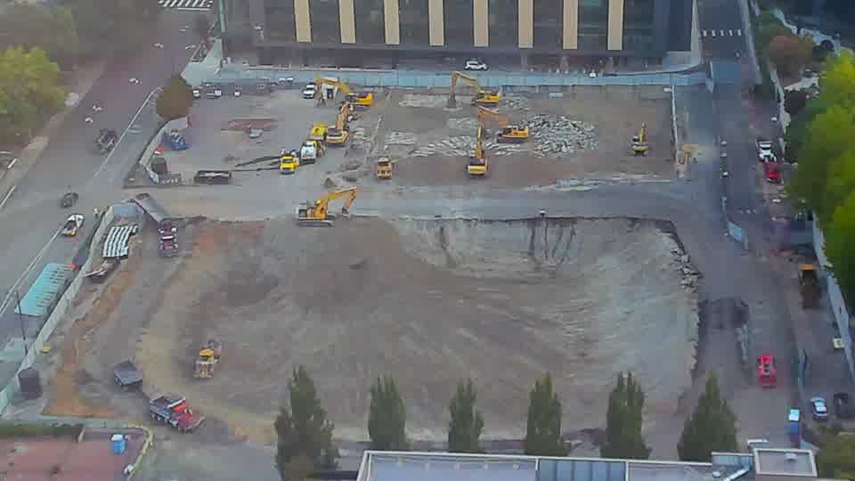 The site maintains a similar appearance, with the positions of the machines and materials holding relatively constant.