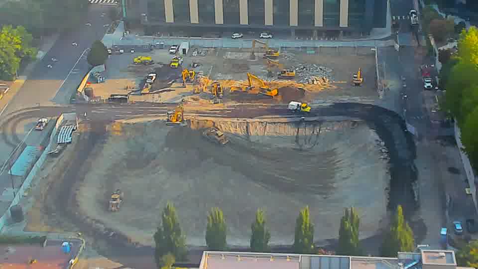The arrangement of equipment appears stable, though the worked area in the center shows further subtle reshaping of the soil.