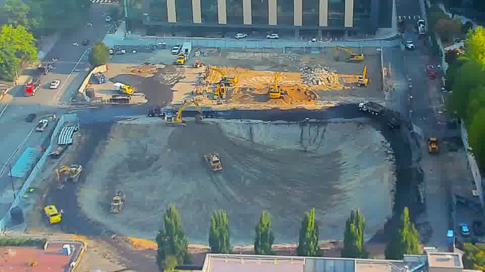 The equipment layout is consistent between these views, with no obvious repositioning of machines or materials.