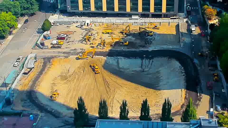 The site appears remarkably stable, with no immediately visible shifts in equipment positions or material arrangements.