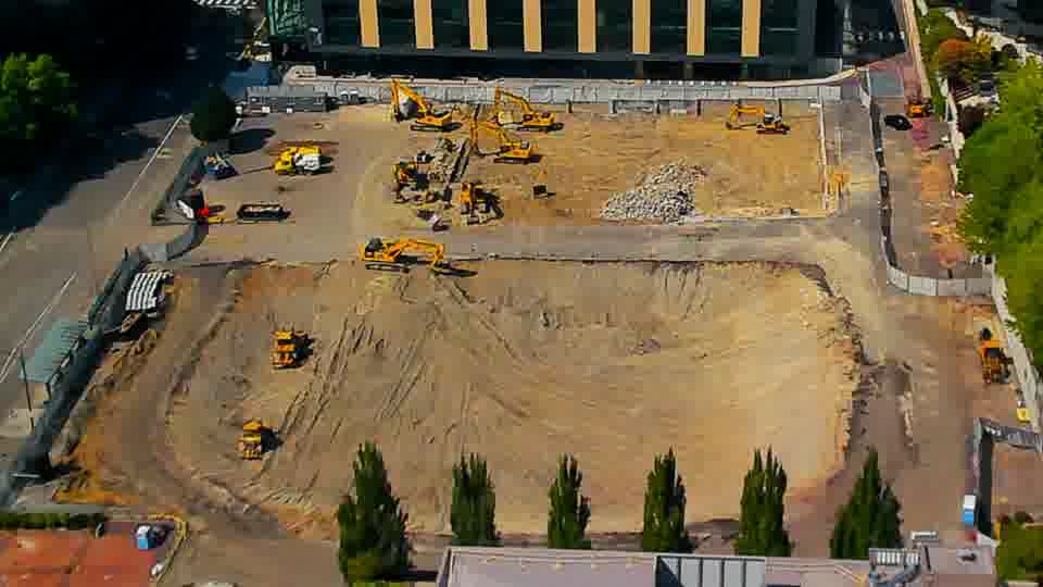 The site maintains a consistent appearance, with no immediately noticeable shifts in equipment placement or ground conditions.