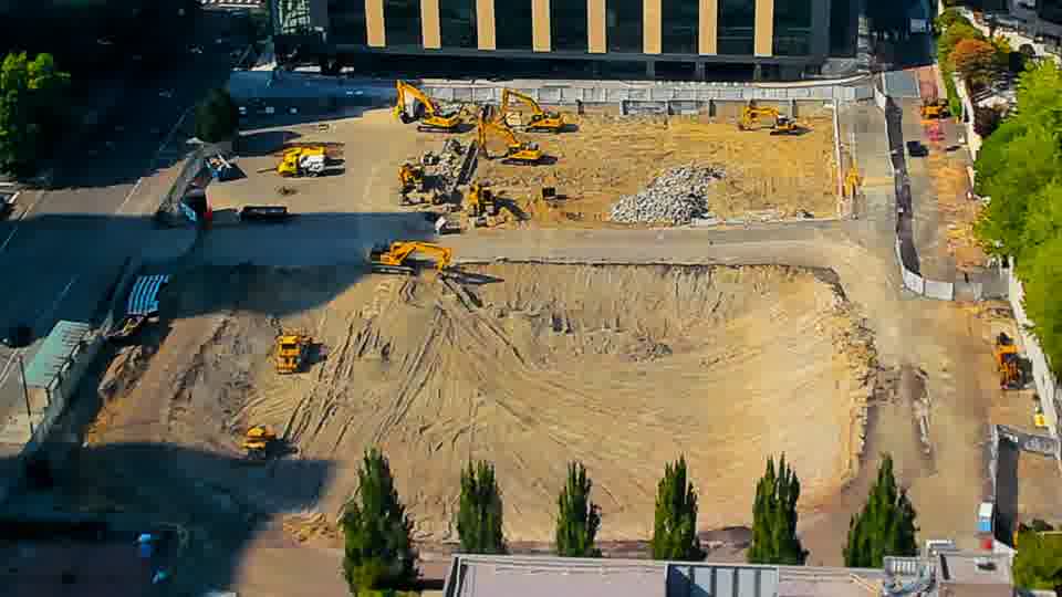 The overall layout of the site appears unchanged, though the patterns in the disturbed earth continue to evolve slightly.