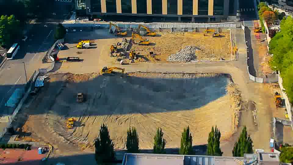 The layout of the equipment and materials remains consistent between the two views, with only slight shifts in shadow patterns.