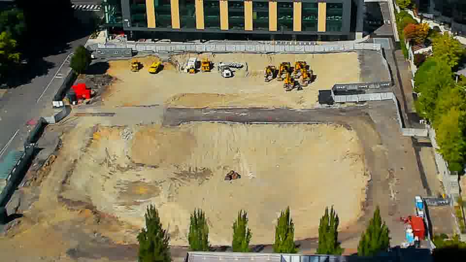 Construction camera frame at 2:45 PM PT. The site appears unchanged, with all visible equipment holding its position from the previous view.