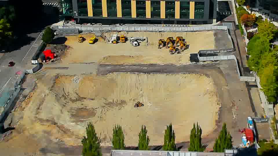 Construction camera frame at 3:00 PM PT. Activity on site is minimal, as the arrangement of machinery and materials remains consistent between views.