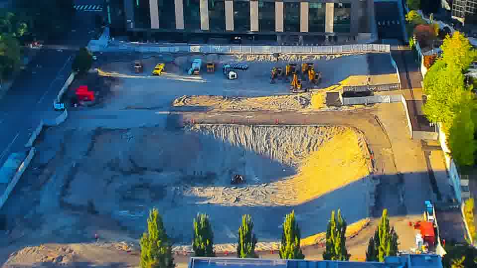 Construction camera frame at 6:30 PM PT. The site appears remarkably stable, with no discernible shifts in equipment or material placement over the last fifteen minutes.