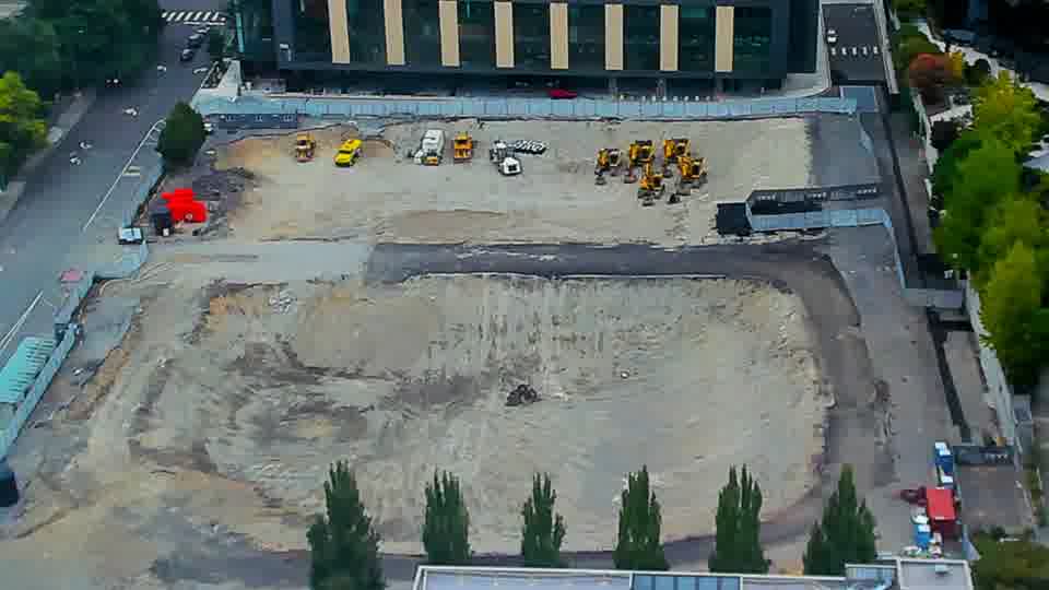 Construction camera frame at 10:45 AM PT. The construction site appears stable, with no obvious shifts in the positions of equipment or vehicles.