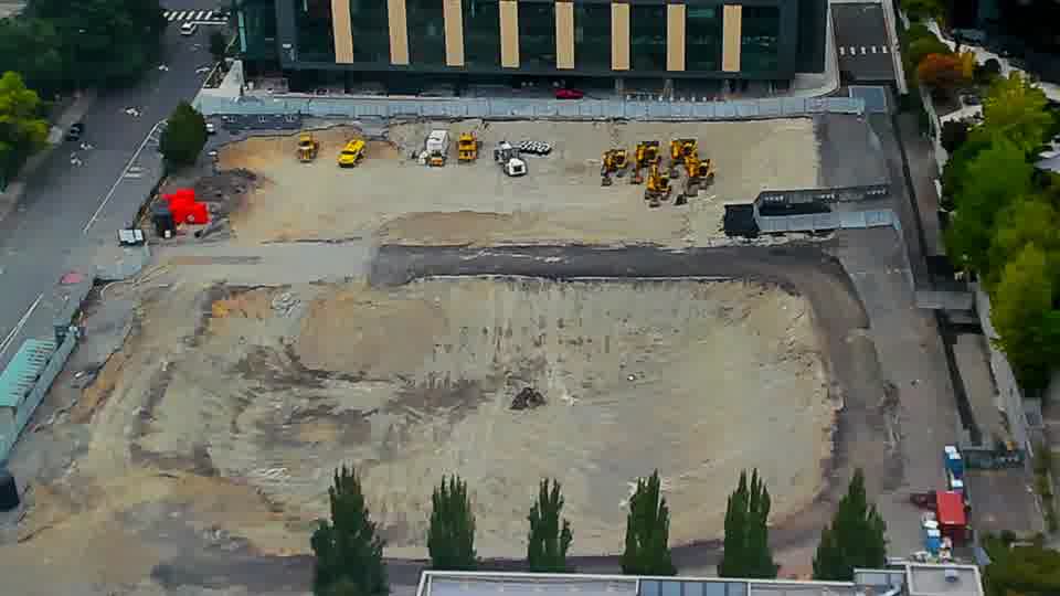 Construction camera frame at 1:30 PM PT. Everything on site appears to be holding its place, with no visible changes in the positions of vehicles or equipment.