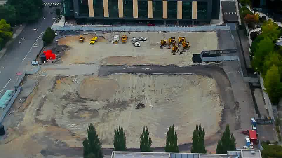 Construction camera frame at 1:45 PM PT. The view from the camera shows no discernible alterations in the site’s layout or equipment positions over the last fifteen minutes.