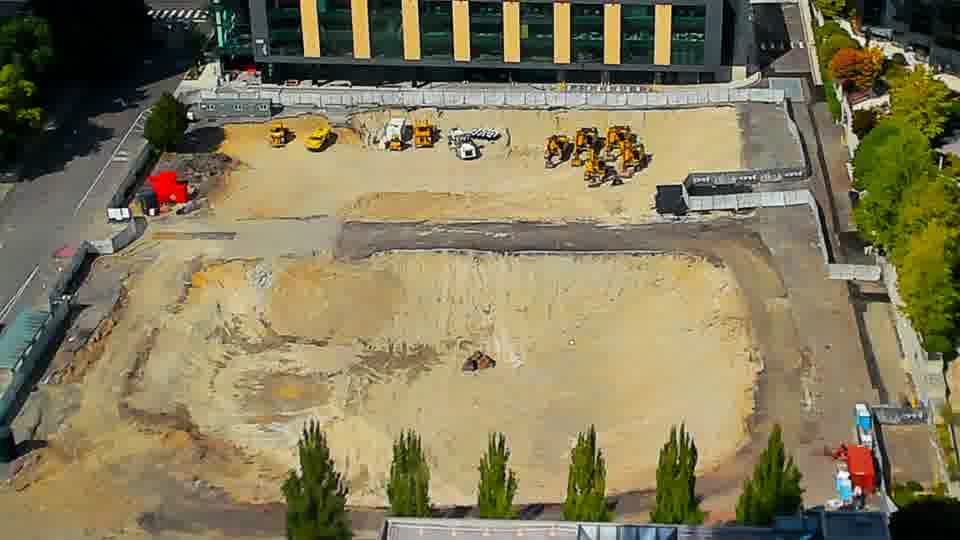 Construction camera frame at 2:45 PM PT. The site continues to display a consistent appearance, with no observable alterations to the positioning of machinery or vehicles.