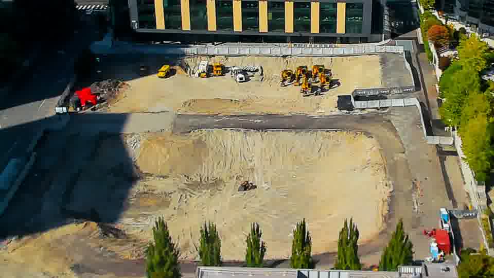 Construction camera frame at 3:45 PM PT. The site’s layout remains consistent, with equipment and materials holding their positions from the prior view.