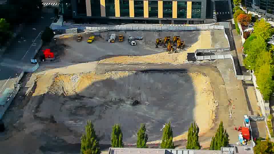 Construction camera frame at 4:30 PM PT. The graded area shows no alterations in equipment placement or visible activity over the last fifteen minutes.