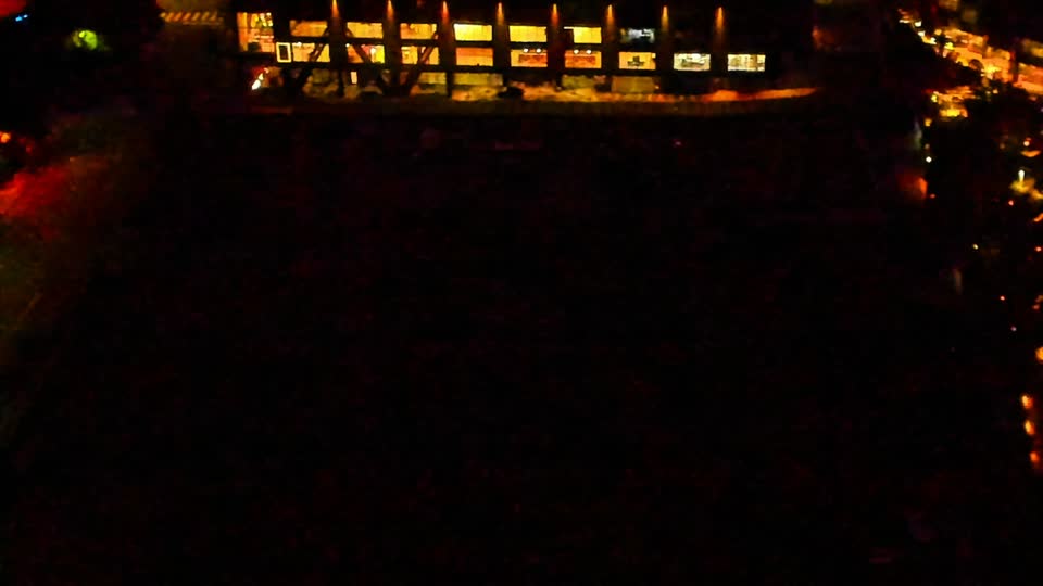 Construction camera frame at 11:00 PM PT. Visibility is too low to assess construction activity.