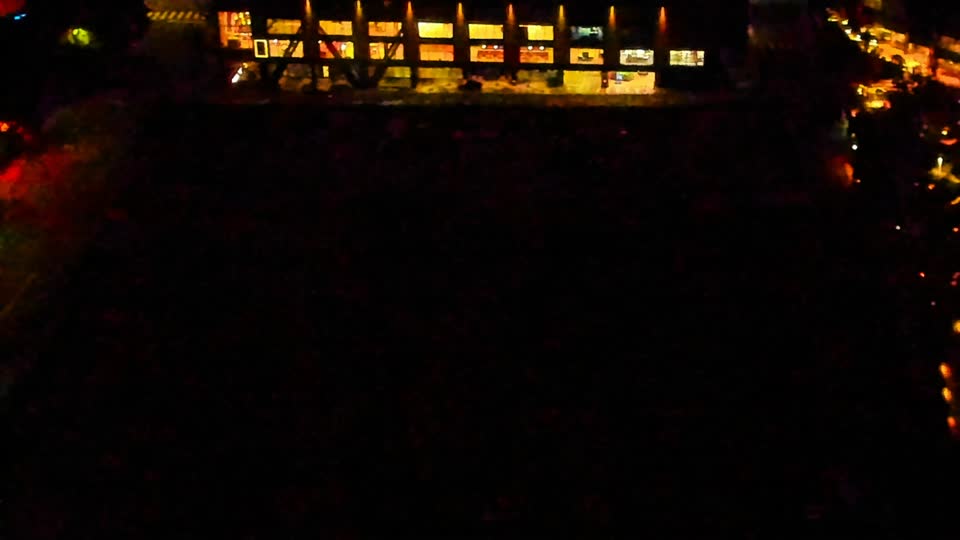 Construction camera frame at 4:00 AM PT. Visibility is too low to assess construction activity.