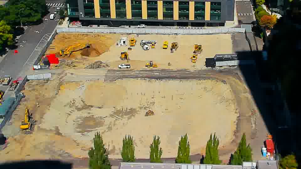 Construction camera frame at 12:45 PM PT. No visible change between these frames.