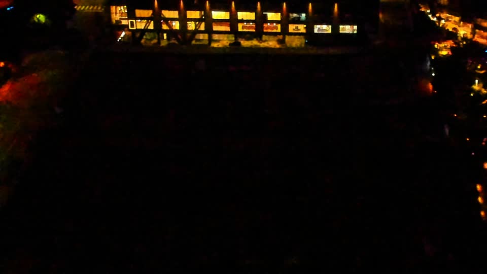 Construction camera frame at 2:00 AM PT. Visibility is too low to assess construction activity.