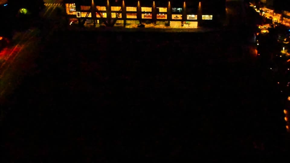 Construction camera frame at 4:00 AM PT. Visibility is too low to assess construction activity.