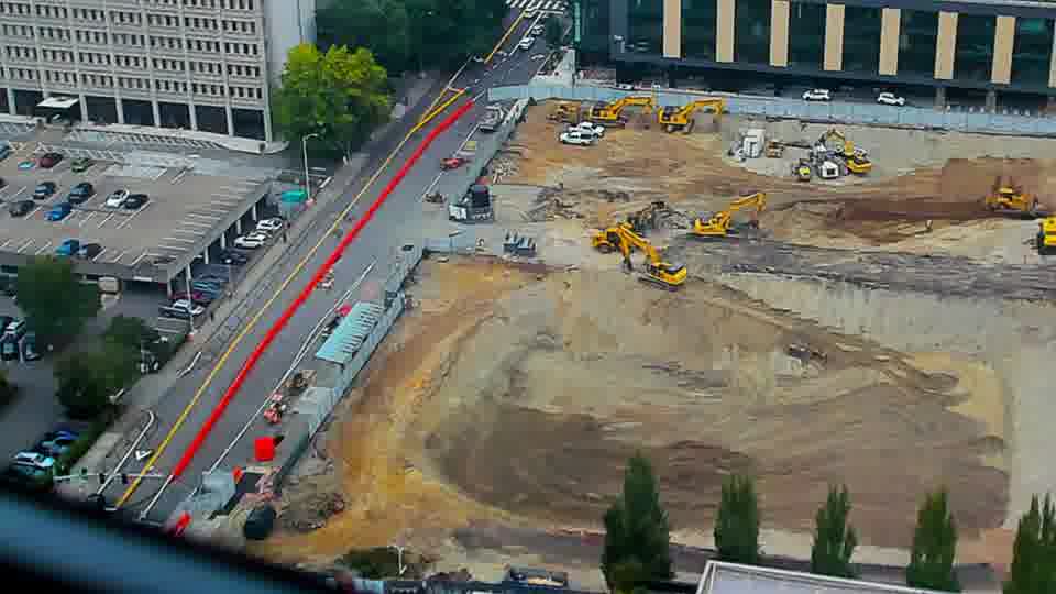 Construction camera frame at 10:15 AM PT. No visible change between these frames.