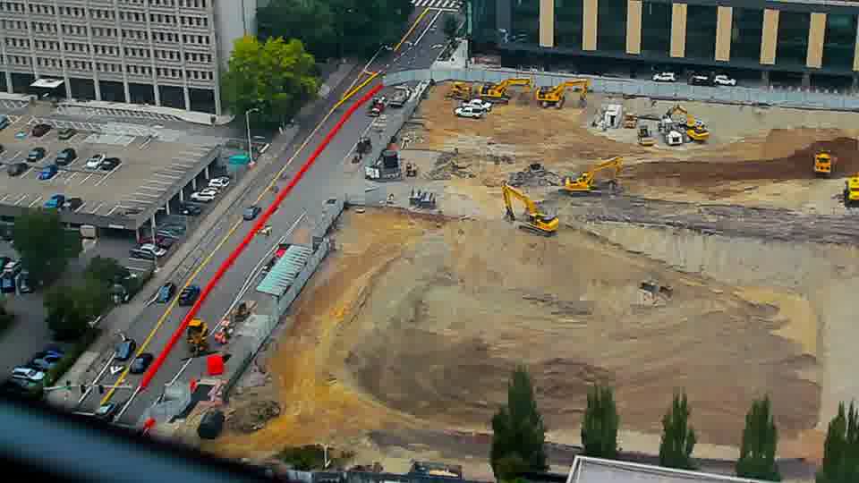 Construction camera frame at 11:00 AM PT. No visible change between these frames.