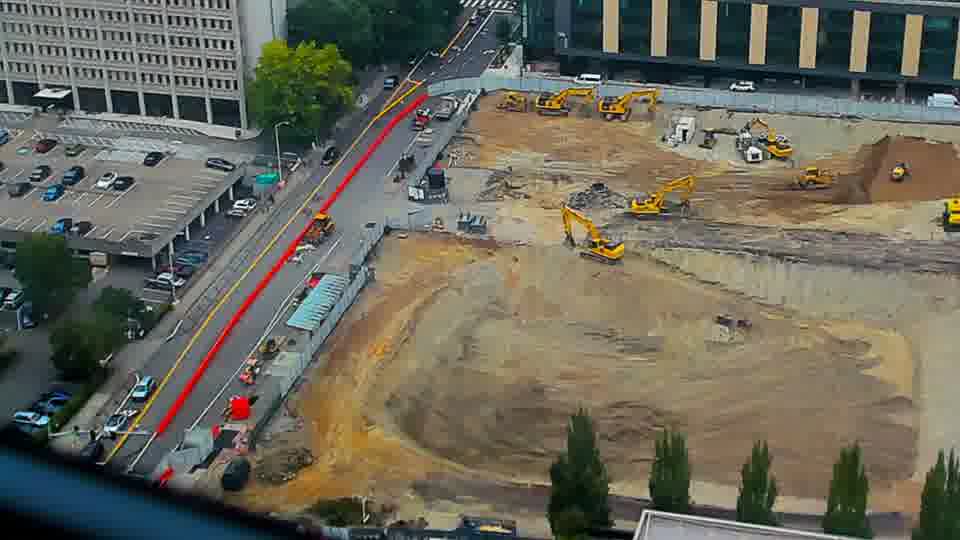 Construction camera frame at 12:00 PM PT. No visible change between these frames.