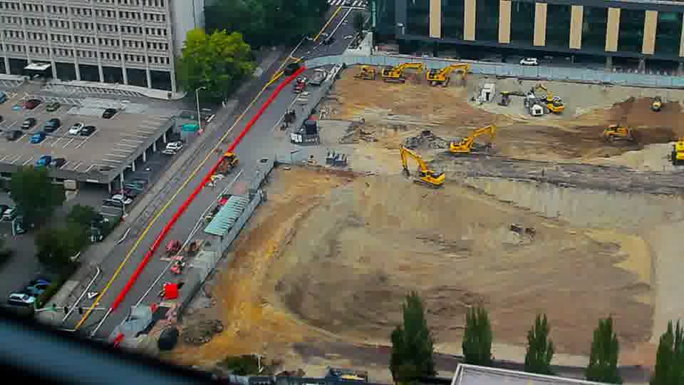 Construction camera frame at 12:15 PM PT. No visible change between these frames.
