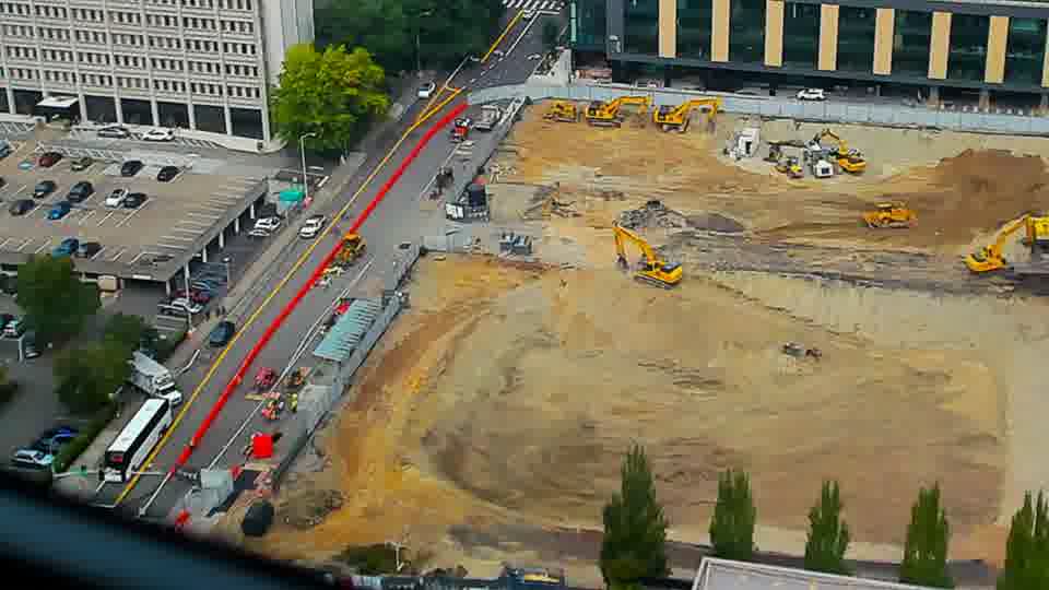 Construction camera frame at 12:30 PM PT. No visible change between these frames.