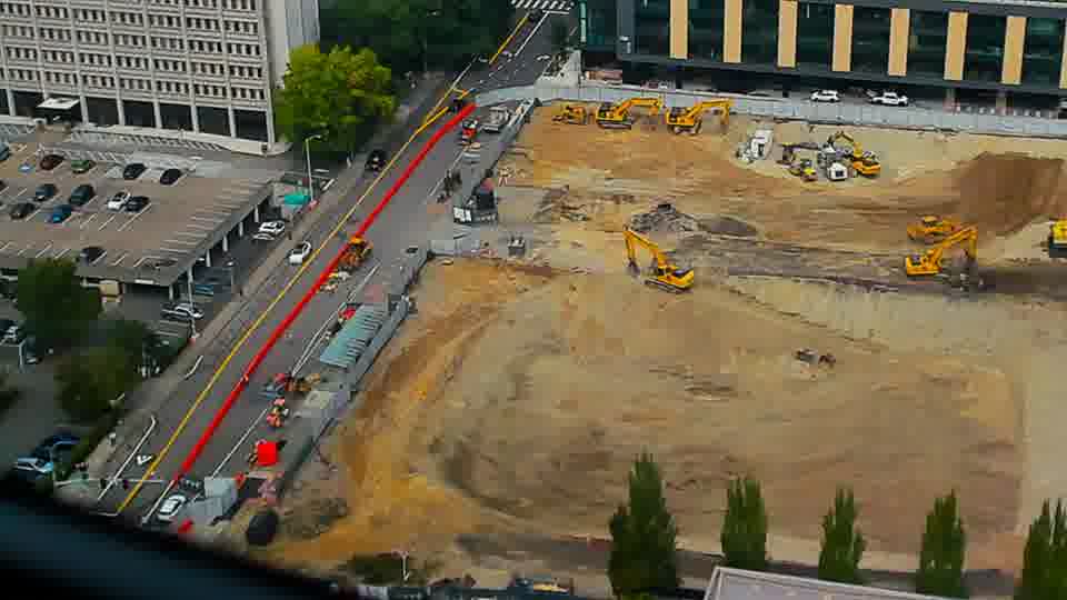 Construction camera frame at 12:45 PM PT. No visible change between these frames.