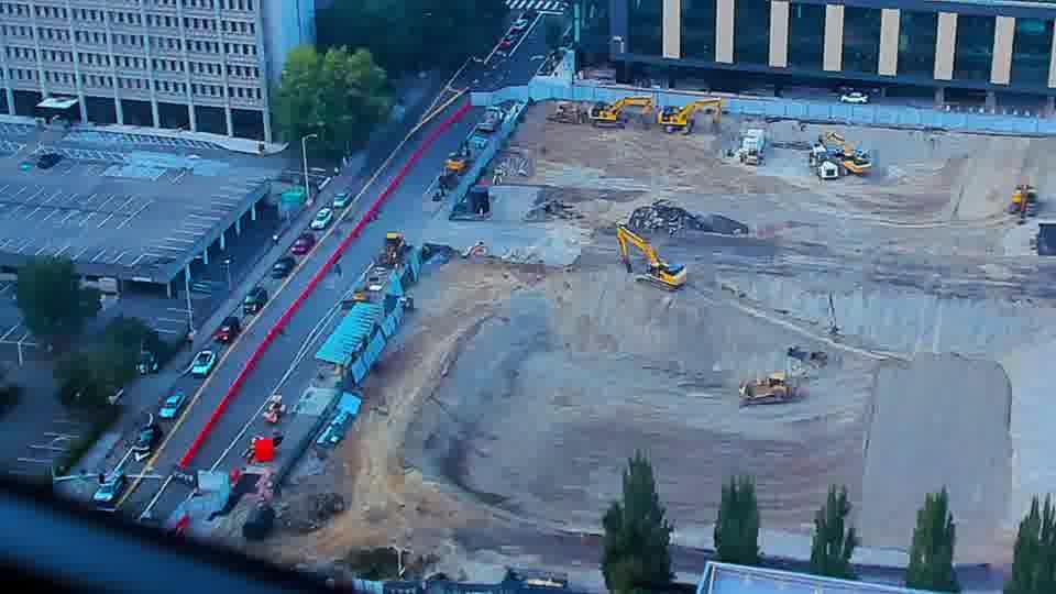 Construction camera frame at 6:00 PM PT. No visible change between these frames.