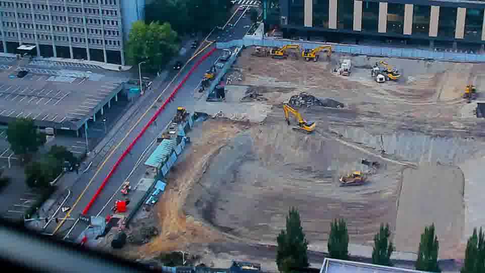 Construction camera frame at 7:00 PM PT. No visible change between these frames.