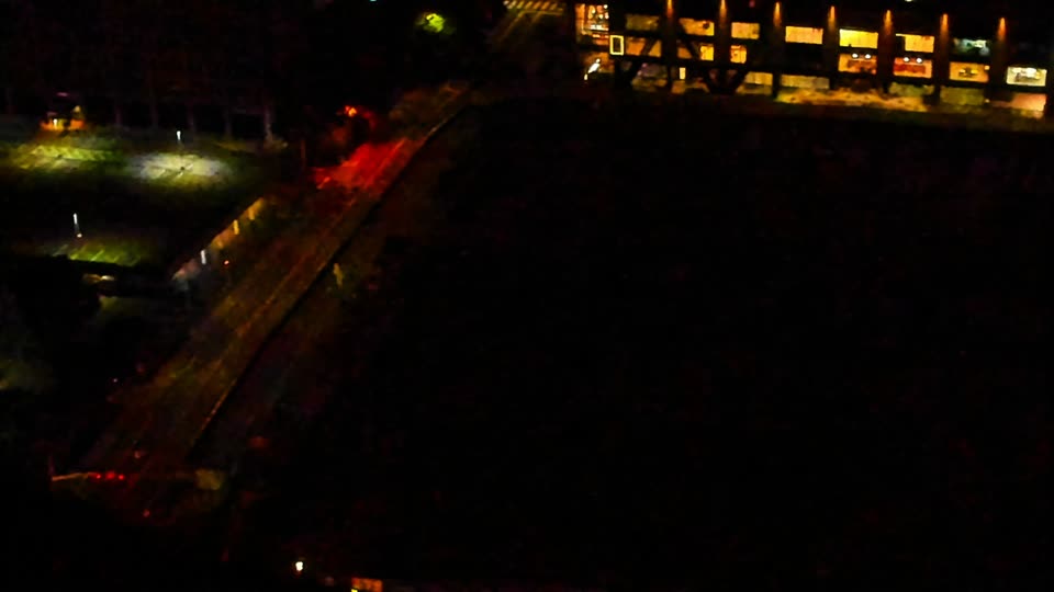 Construction camera frame at 2:00 AM PT. Visibility is too low to assess construction activity.